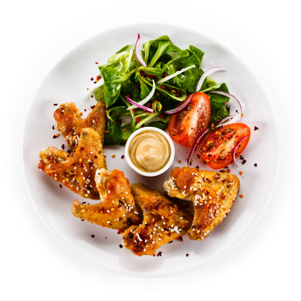 Grilled chicken wings on white background