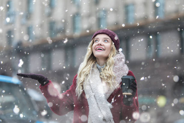 istock Young woman enjoying with snow 1125025683