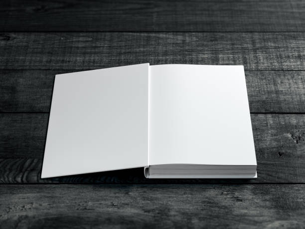 istock White Open book Mockup on dark wooden table background 1125025865