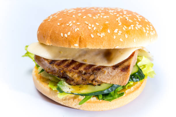 istock tasty burger with cheese and vegetables 1125026690