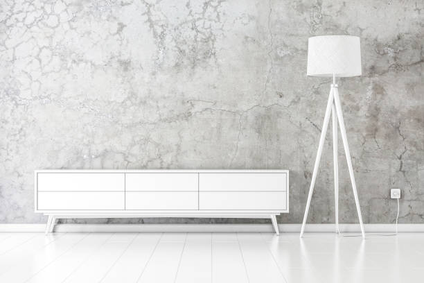 istock White tv console mockup with modern floor lamp in empty room 1125027775