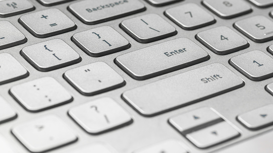 A close-up of the enter key on the computer keyboard