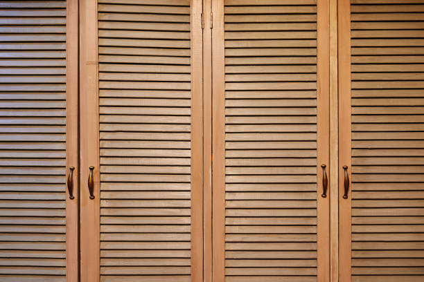 istock Rustic brown wooden window shutters, wall background 1125030837