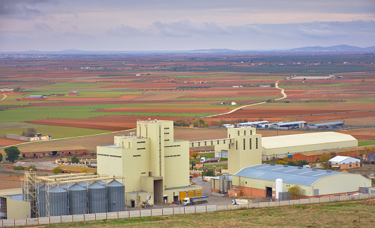 CONSUEGRA, SPAIN - NOVEMBER 22, 2018: Route of Don Quixote. Industrial area of ​​the city of Castilla La Mancha. Nature, agriculture and industry together in one place.