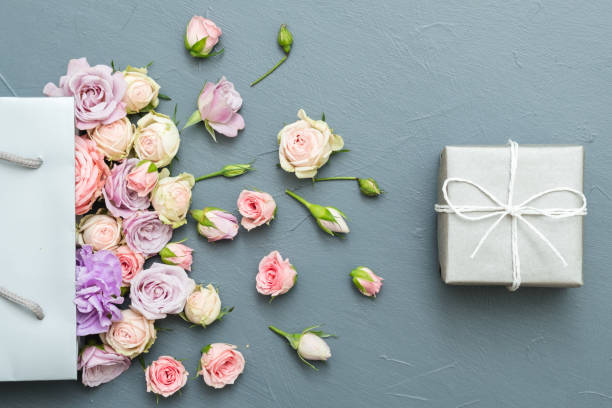 istock mothers present flowers gift box grey background 1125031273