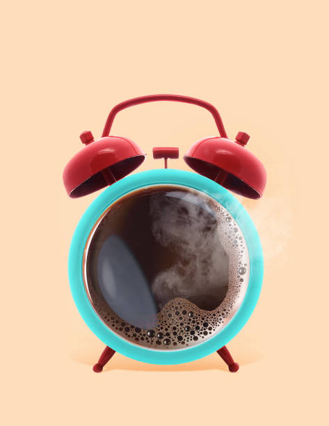 istock Twin bell alarm clock with coffee mug background, Coffee clock, creative idea. minimal concept, coffee cup time clock concept design 1125032065