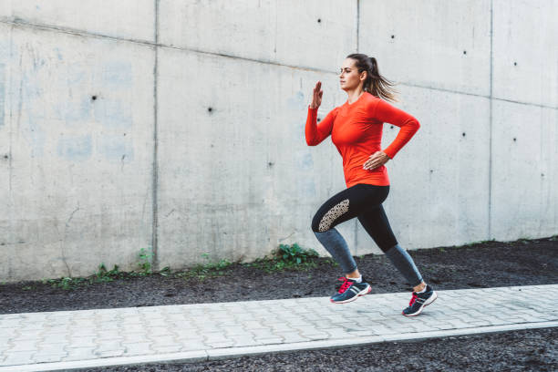 istock Woman running outdoors in the city 1125038849
