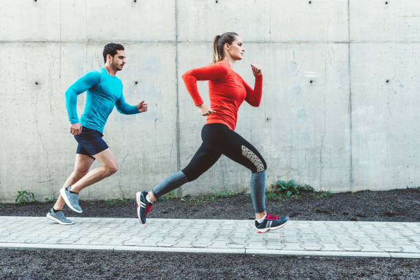 istock Fitness couple running together 1125038880