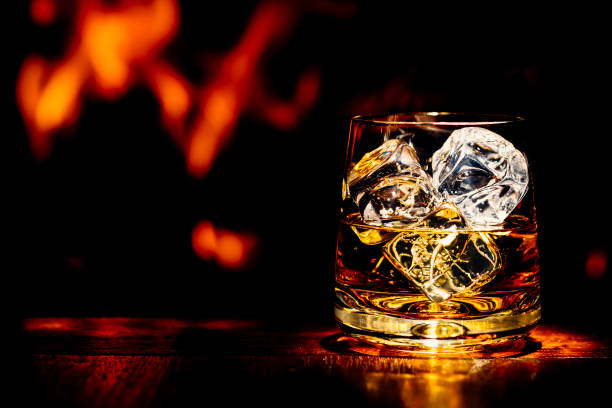 Whisky On Table With Flame Of Wood Burning Stove Stock Photo - Download Image Now - Whisky Glass, Whiskey, Black Background - iStock Whisky On Table With Flame Of Wood Burning Stove Stock Photo - Download Image Now - Whisky Glass, Whiskey, Black Background - iStock