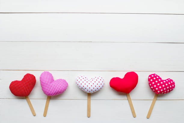 istock Valentine's hearts on white wooden background. 1125041329