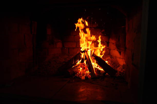 istock burning firewood in a brick fireplace 1125042881