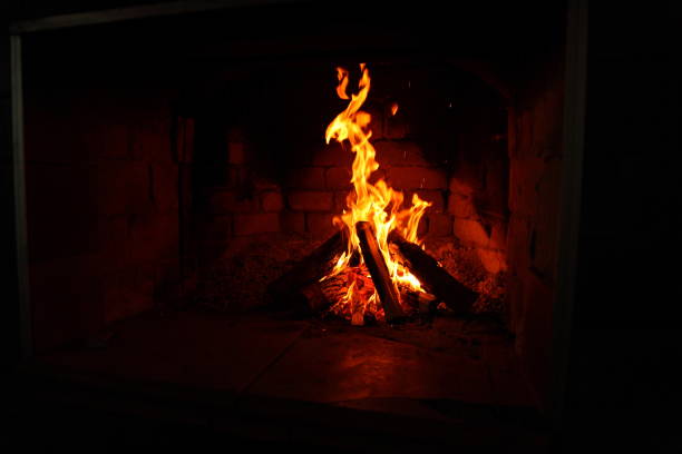 istock burning firewood in a brick fireplace 1125042886