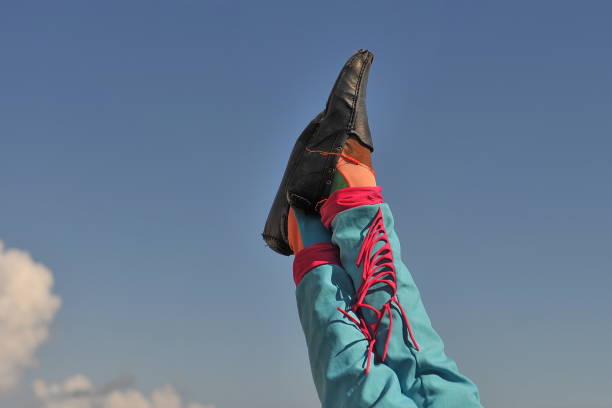 istock Circus in the town square. The acrobat's legs are looking up. 1125046835