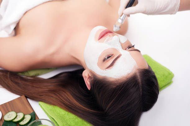 istock A young woman with a face pack. 1125047046