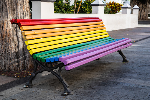 Rainbow bench on a city street. La Palma Island