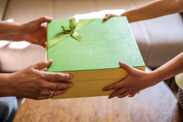 istock Unrecognizable person receiving a gift box 1125054717