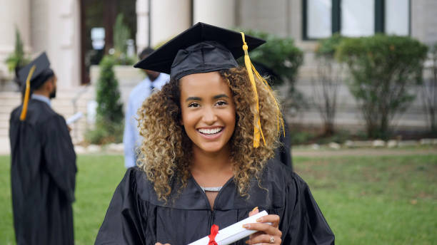 istock Beautiful female college graduate 1125055146