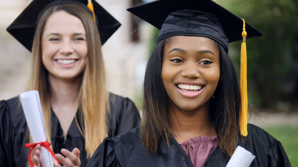 istock Excited female college graduates 1125055168
