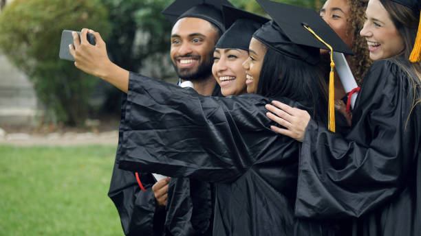 istock Excited college grads taking selfie 1125055172