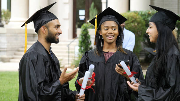 istock Excited group of college graduates 1125055180