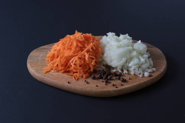 istock sliced onions and grated carrots on the cutting Board 1125055838