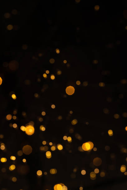 Gold glittering star light and bokeh. Abstract background.