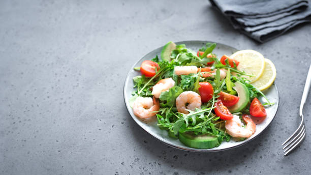 istock Avocado Shrimp Salad with Arugula and Tomatoes 1125061385