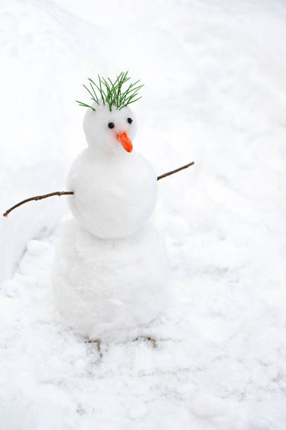 istock Cute little snowman over snowy white background. 1125066543