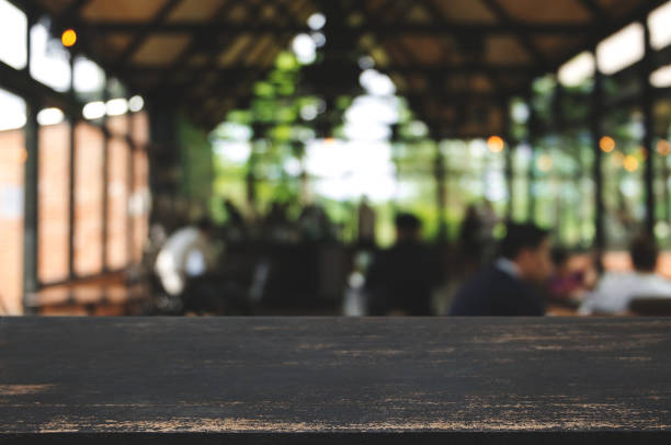 istock empty wooden plank with blurred cafe bar background. 1125071093