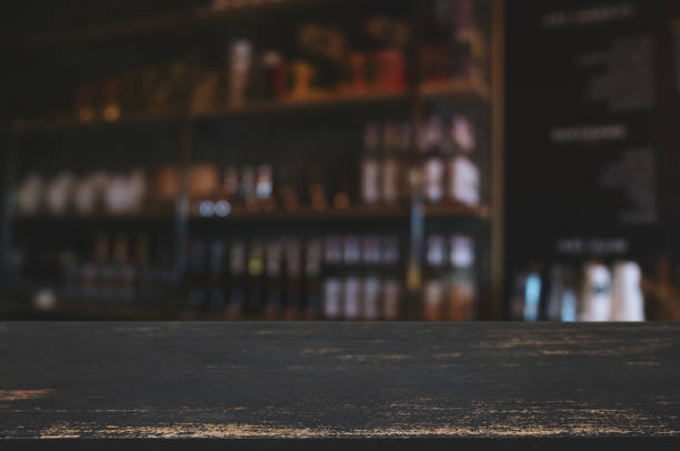 istock wooden table top in front of blur restaurant background. 1125071153