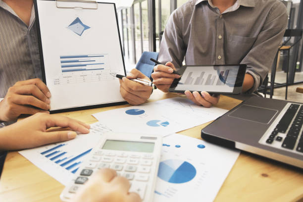 istock Business people meeting discussing on digital tablet with data graph 1125076063