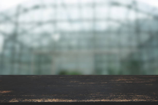istock wooden table top in front of blur restaurant background. 1125076138