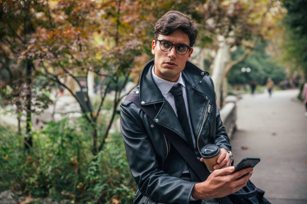 istock Coffee break and texting in the park 1125079231