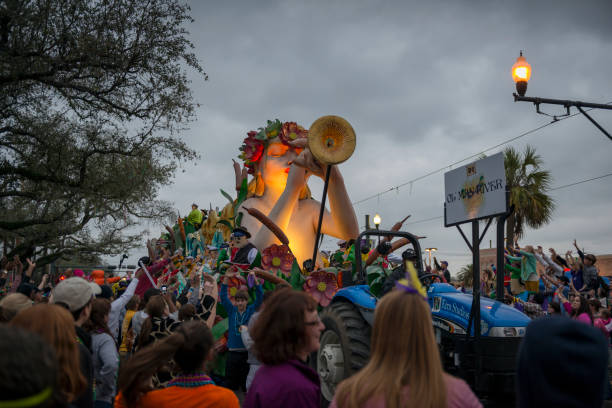 An ornately decorated float belonging to the Krewe of Endymion passes through a crowd on Canal Street during Mardi Gras in New Orleans, Louisiana
