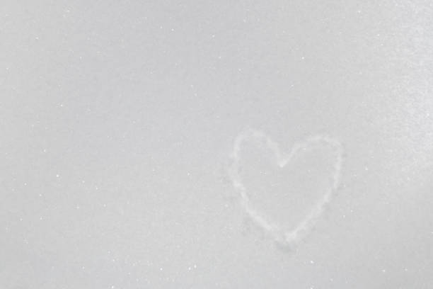 istock drawing of heart on snow 1125084957