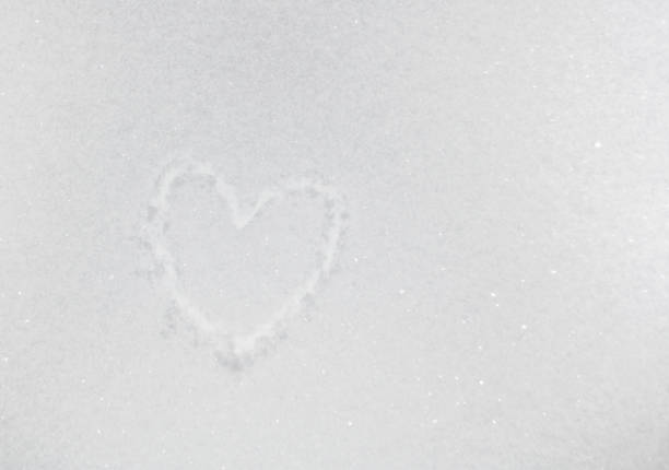 istock drawing of heart on snow 1125084960