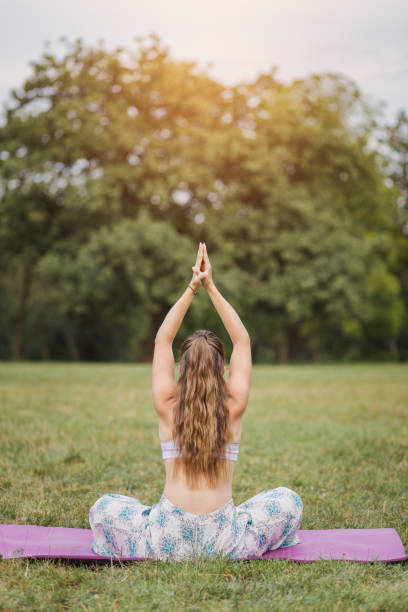 istock Girl doing yoga outdoors 1125089070
