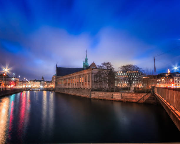 Church of holmen or as locally known Holmen Kirke Copenhagen Denmark during early morning blue hour with dreamy water in foreground Church of holmen or as locally known Holmen Kirke Copenhagen Denmark during early morning blue hour with dreamy water in foreground kanal stock pictures, royalty-free photos & images