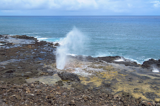 Spectacular Spouting Horn near the Pacific Ocean, a scenic blowhole on the South Shore of Kauai near Poipu, Hawaii