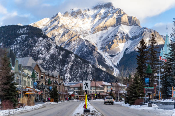 View of downtown Banff National Park, a Unesco World Heritage Site, during the winter. Cascade Mountain in background stock photo