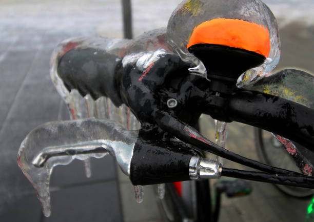 Bucharest, Romania -  January 26, 2019: A bicycle from a bicycle sharing system is covered with ice after an winter ice storm, in Bucharest, Romania.