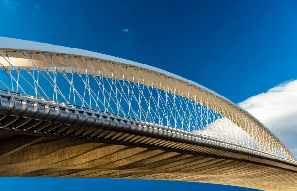 istock Metallic Arch Bridge in Prague against Blue Sky with Clouds 1125117037