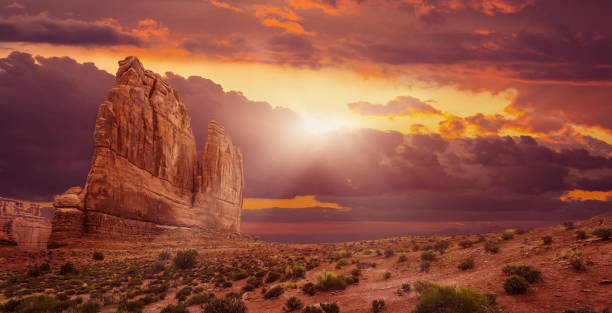 istock Rock Formations On Landscape Against Sky During Sunset 1125124210