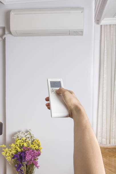 istock Remote control directed on air conditioner systrem. 1125130831