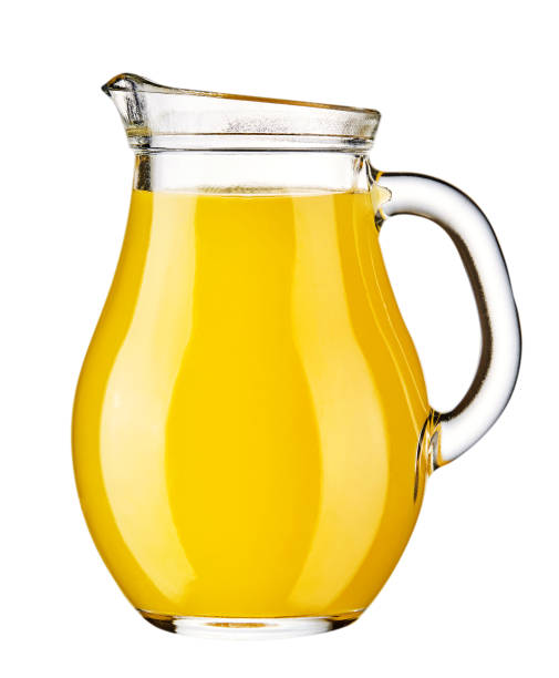 istock Orange juice in pitcher. Isolated on white background. 1125136581
