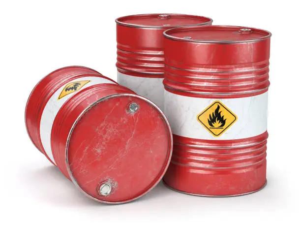 Photo of Red metal oil barrels isolated on white background. Oil, gas and petroleum industry and manufacturing.