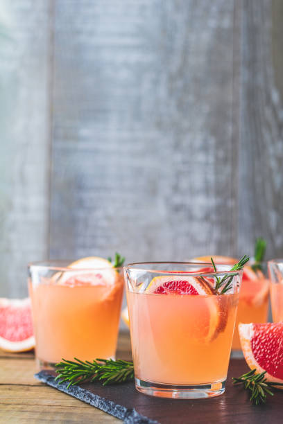 istock Fresh pink alcoholic cocktail with grapefruit, ice and rosemary 1125143133