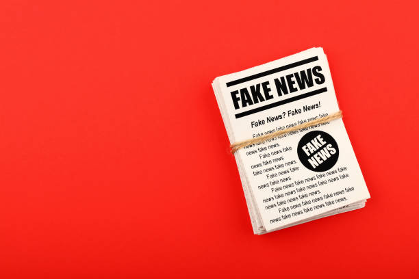 istock Stack of FAKE NEWS newspapers over red 1125143286
