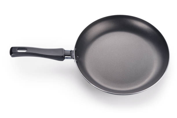 istock Black frying pan isolated on white with clipping path 1125145633