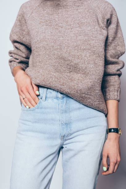istock Young woman wearing plain oversized brown sweater 1125149347